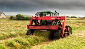 Tractor cutting grass