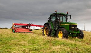 Tractor cutting grass