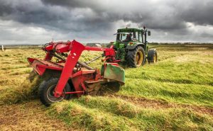 Tractor cutting grass